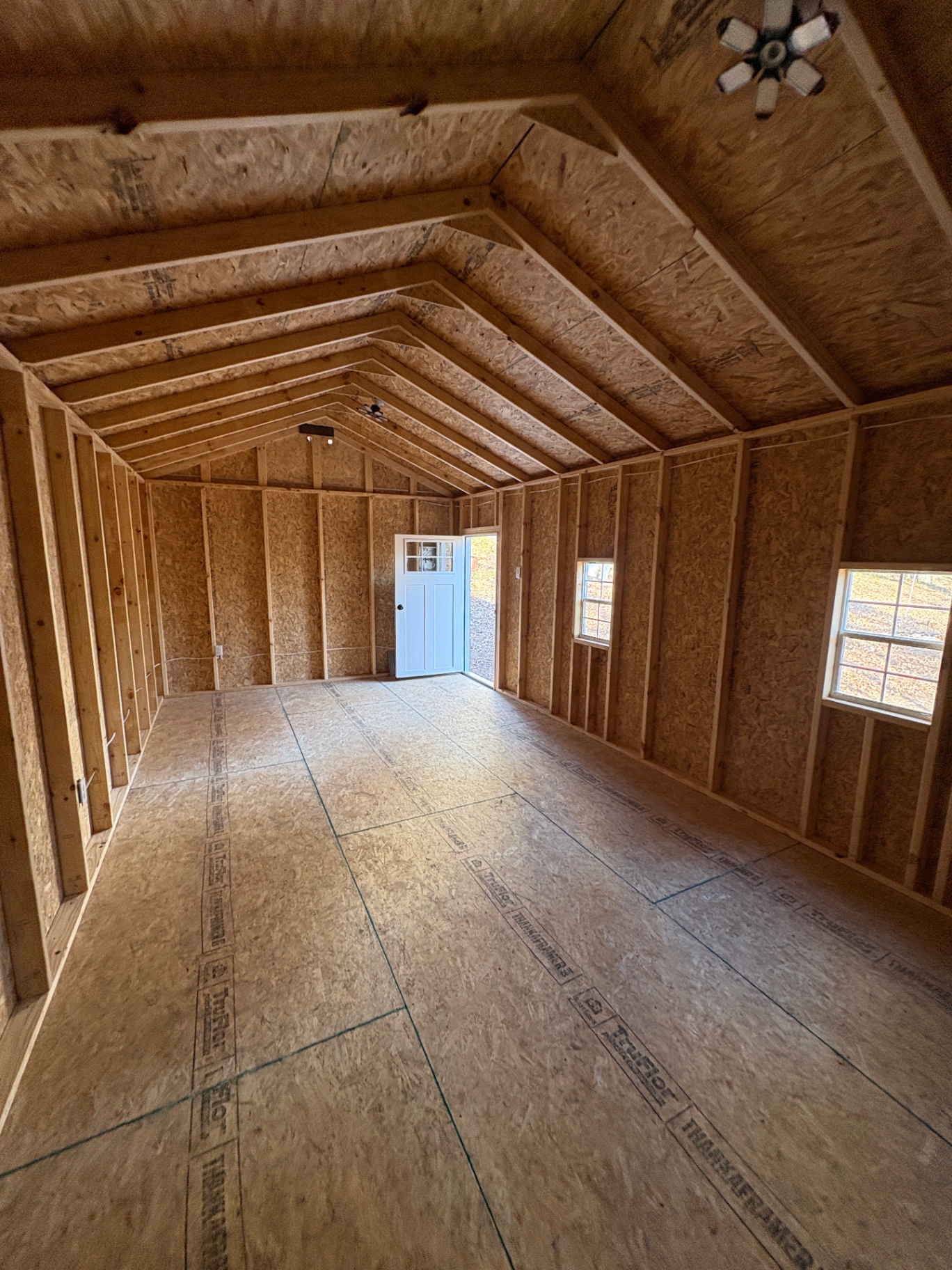 Inside a Southern Shed Co. build: 3/4-inch TruFloor tongue-and-groove floor, framed walls and rafters
